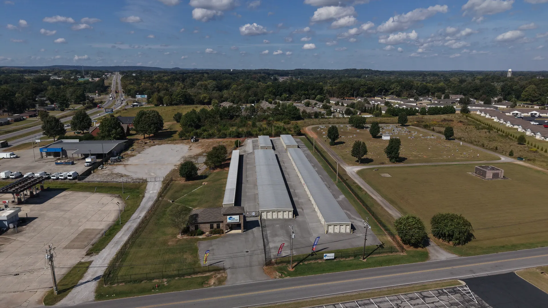 Rows of drive-up storage units with roll-up doors at SB Storage in Tuscumbia