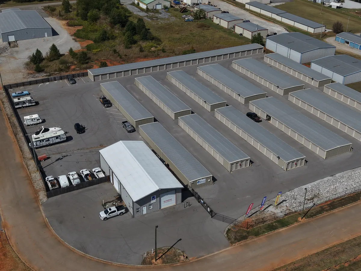 RVs, campers and trucks parked inside the fence at SB Storage on Mitch Avenue
